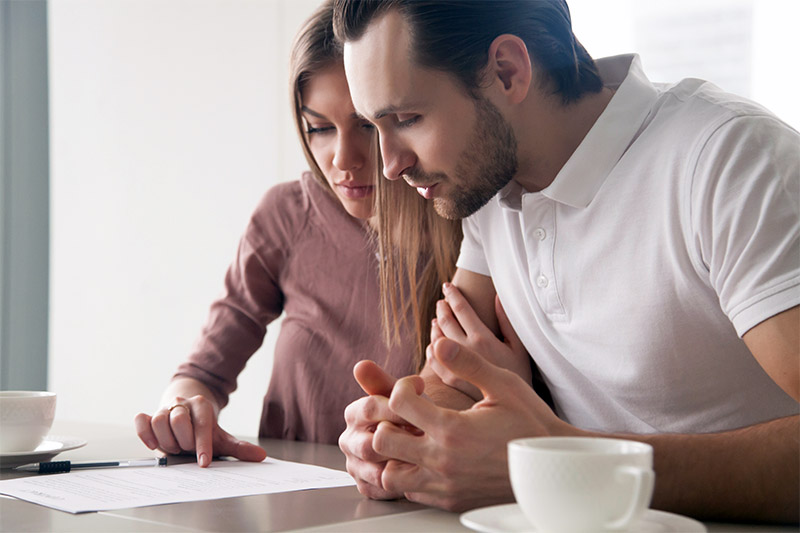 Couple reviewing no down payment mortgage options